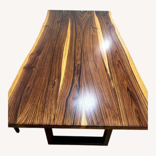 Used Dark Brown Wood Dining Table for sale on AptDeco