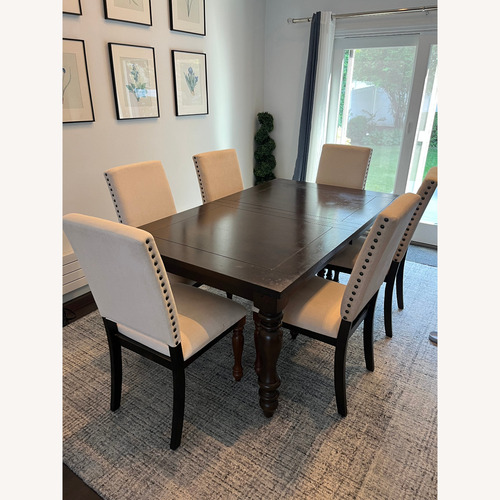 Used Raymour & Flanigan Dark Brown Wood Dining Set for sale on AptDeco