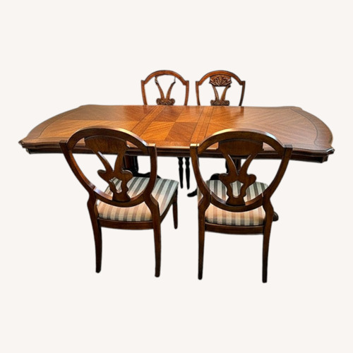 Used Ashley Furniture Dark Brown Wood Dining Table for sale on AptDeco