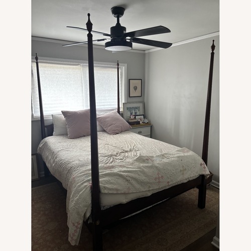 Used Dark Brown Wood Queen Bed for sale on AptDeco