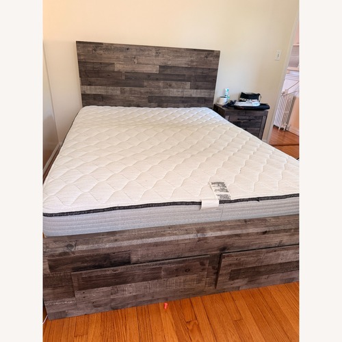 Used Raymour & Flanigan Wood Queen Bed for sale on AptDeco