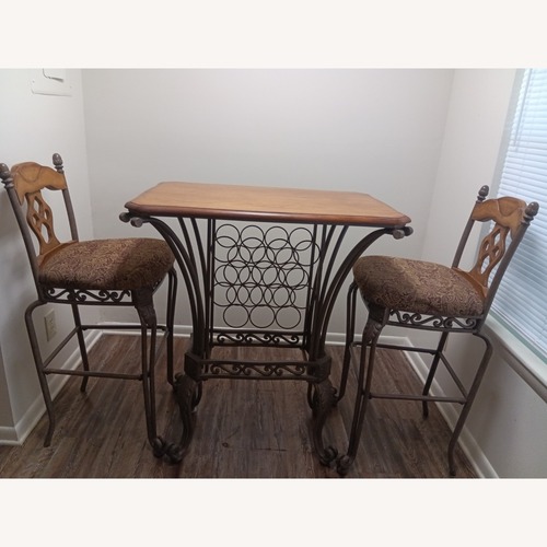 Used Iron Bistro Table Set with Built in Wine Rack for sale on AptDeco