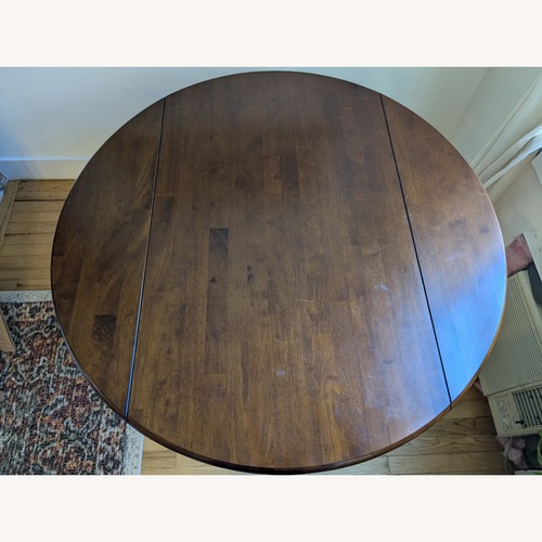 Used Amazon Dark Brown Wood Dining Table for sale on AptDeco