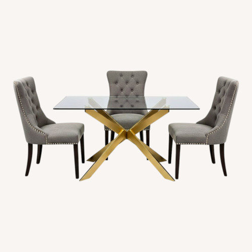 Used Gold and Glass Dinnete Table with 4 Gray Chairs for sale on AptDeco