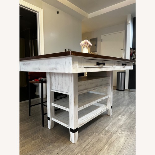 Used Ashley Valebeck Counter Height Storage Table w Wine Rack for sale on AptDeco