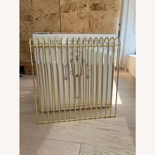 Used Curva Magazine Rack, Gold for sale on AptDeco
