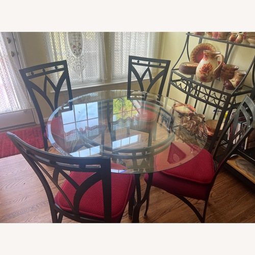 Used Black Glass Dining Set for sale on AptDeco