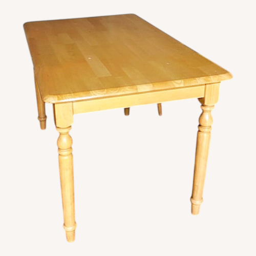 Used Natural Wood Dining Table for sale on AptDeco