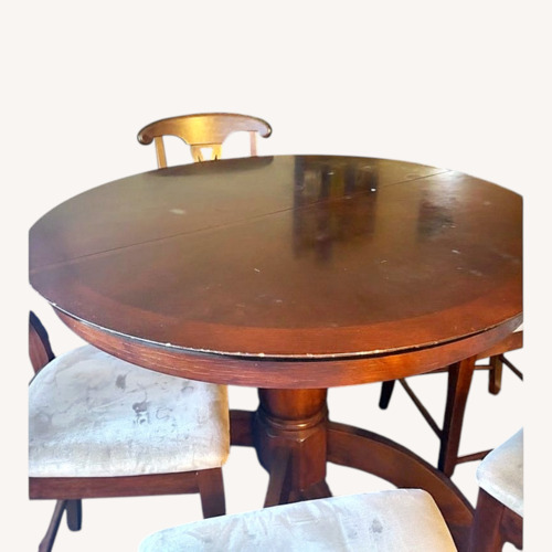 Used Dark Brown Wood Dining Table for sale on AptDeco