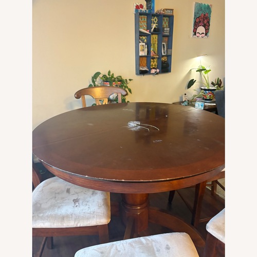 Used Dark Brown Wood Dining Table for sale on AptDeco