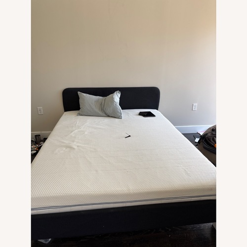 Used IKEA SLATTUM Black Wood Queen Bed for sale on AptDeco