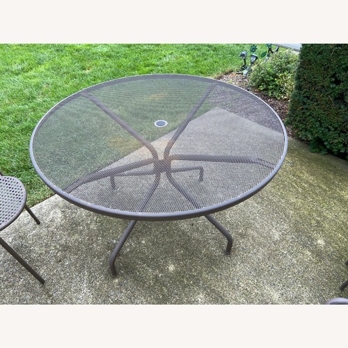 Used EMU Cambi 48-Inch Round Steel Outdoor Dining Table for sale on AptDeco