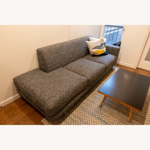 Used Della Robbia Dark Gray One Arm Sofa for sale on AptDeco