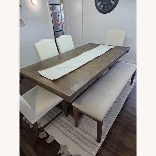 Used Ashley Furniture Dark Brown Wood Dining Set for sale on AptDeco