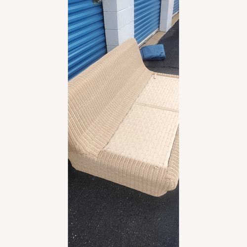 Used Crate & Barrel Ipanema Wicker Armless Outdoor Sofa for sale on AptDeco