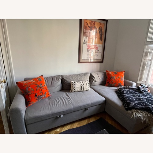 Used Article Nordby 104" Reversible Sleeper Sectional - Henge Gray for sale on AptDeco