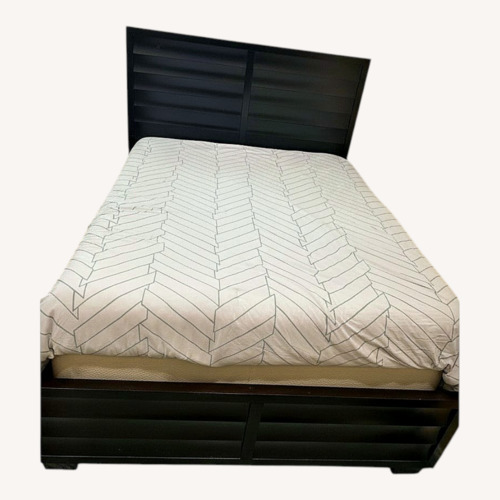 Used Macy's Dark Brown Wood Queen Bed for sale on AptDeco