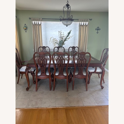 Used Dark Brown Wood Dining Chair for sale on AptDeco