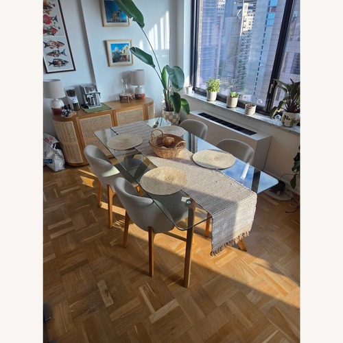 Used Article Natural Glass Dining Table for sale on AptDeco