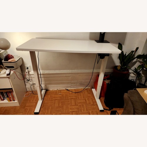 Used White Electric Adjustable Standing Desk for sale on AptDeco