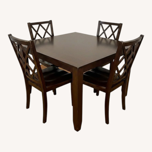 Used Dark Brown Wood Dining Table and 4 Chairs for sale on AptDeco