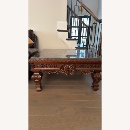 Used Ashley Furniture Dark Brown Wood Coffee Table for sale on AptDeco