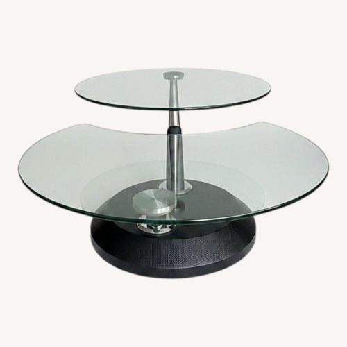 Used Raymour & Flanigan Black Glass Coffee Table for sale on AptDeco