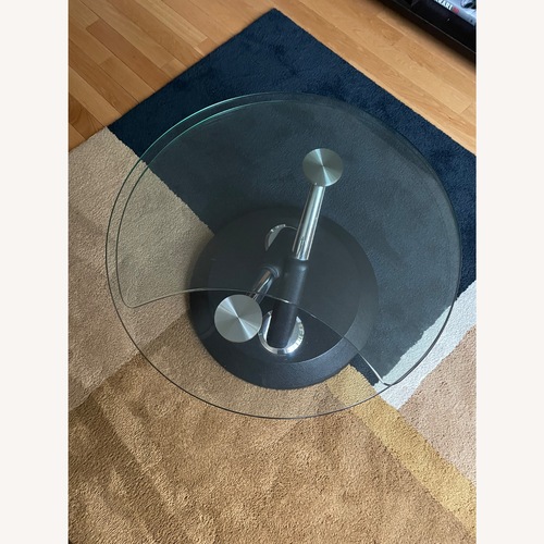 Used Raymour & Flanigan Black Glass Coffee Table for sale on AptDeco