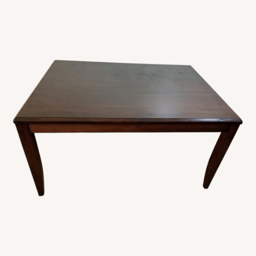 Used Dark Brown Wood Dining Table for sale on AptDeco