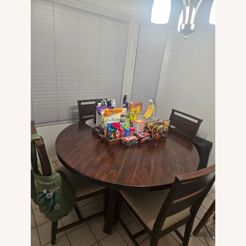 Used Dark Brown Wood Dining Set for sale on AptDeco