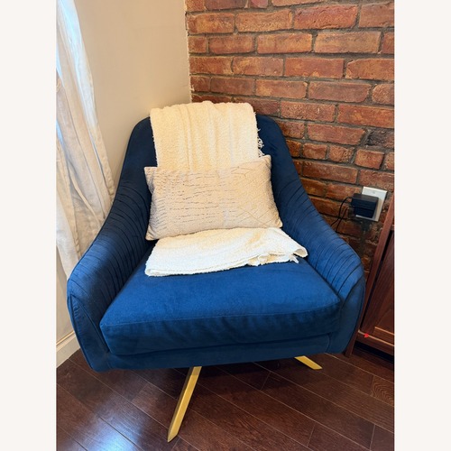 Used West Elm Blue Roar & Rabbit Pleated Swivel Chair for sale on AptDeco
