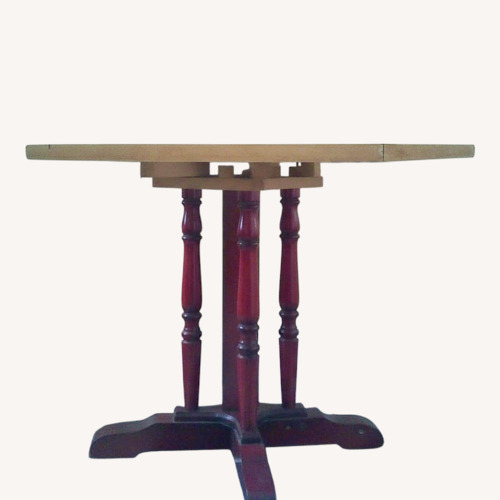 Used Vintage Table With Drop Leaves and Red Carved Base for sale on AptDeco