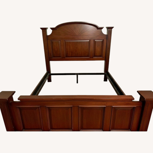 Used Raymour & Flanigan Dark Brown Wood Queen Bed for sale on AptDeco