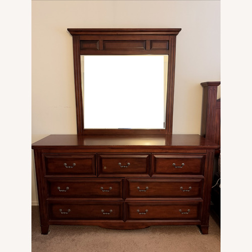 Used Raymour & Flanigan Dark Brown Wood Dresser for sale on AptDeco