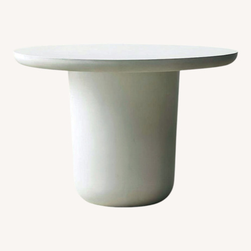 Used CB2 Lola 45" Round Ivory Concrete Dining Table for sale on AptDeco