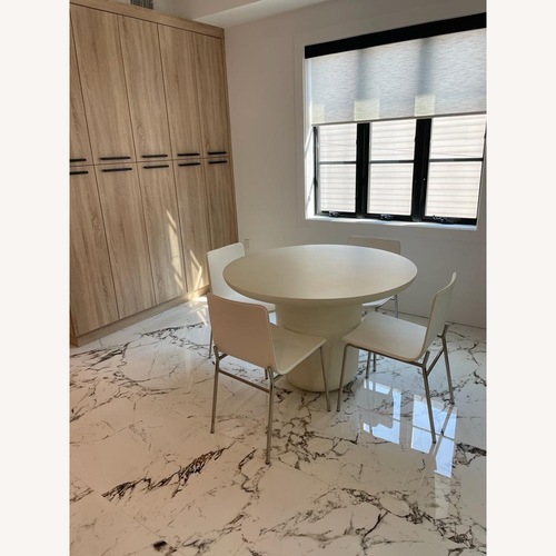 Used CB2 Lola 45" Round Ivory Concrete Dining Table for sale on AptDeco