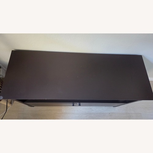 Used Dark Brown Wood TV Table for sale on AptDeco