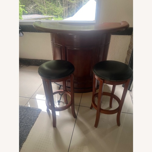 Used Mahagoni Bar With 2 Wood/ Leather Stools  for sale on AptDeco