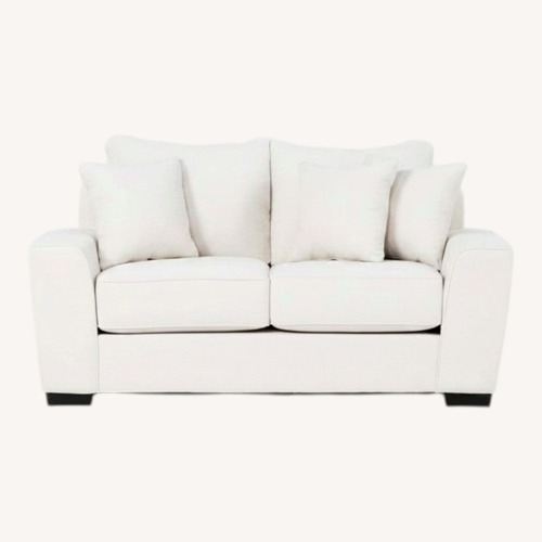 Used Living Spaces Large Cream Loveseat for sale on AptDeco