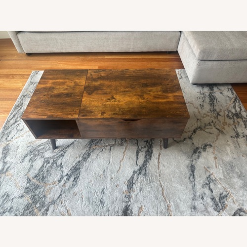 Used Dark Brown Wood Coffee Table for sale on AptDeco