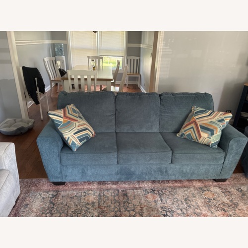 Used Ashley Furniture Cashton Blue Linen Sleeper Sofa for sale on AptDeco