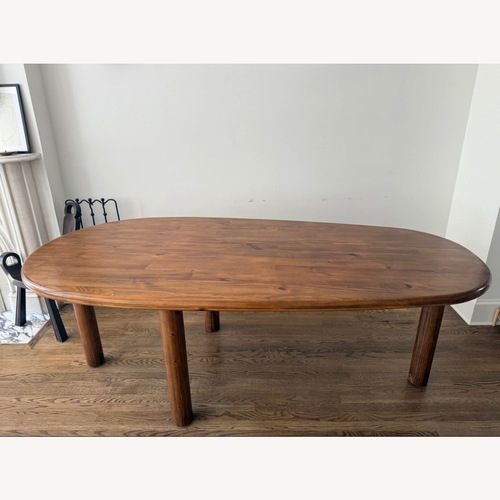 Used Dark Brown Wood Dining Table for sale on AptDeco