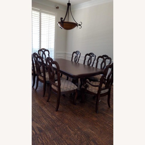 Used Samuel Lawrence Dark Brown Wood Dining Set for sale on AptDeco