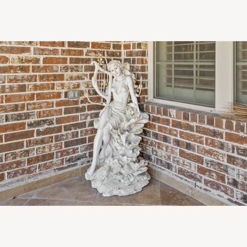 Used Statue of Lady with Harp for sale on AptDeco