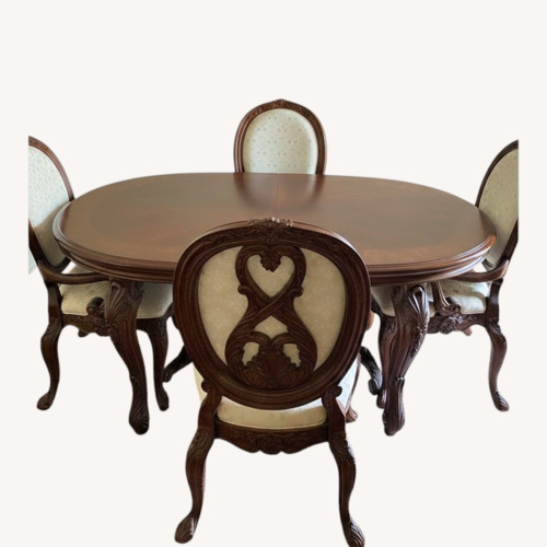 Used Dark Brown Wood Dining Table with Eight Chairs for sale on AptDeco