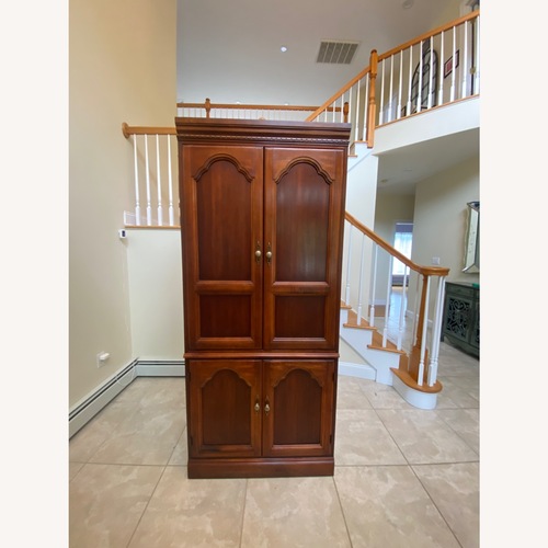 Used Queen Ann Style Solid Wood Entertainment Armoire  for sale on AptDeco