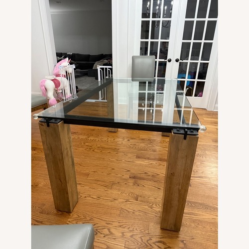 Used Raymour & Flanigan Natural Wood Dining Table for sale on AptDeco