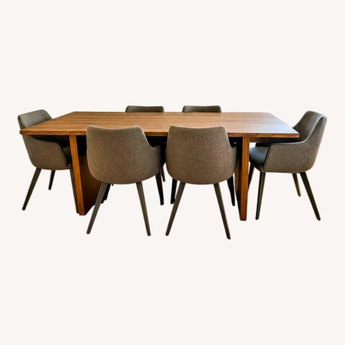 Used Wood Dining Table with 8 Upholstered Chairs for sale on AptDeco