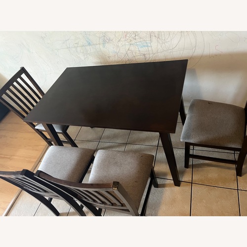 Used Dark Brown Wood Dining Set for sale on AptDeco