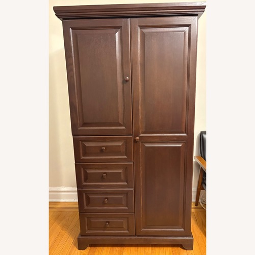 Used Gothic Cabinet Craft Dark Brown Wood Armoire for sale on AptDeco